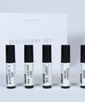 Al Ansary Unisex Perfume Discovery Set with sample vials in a white and black presentation box.